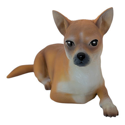 tan Chihuahua Dog figurine in a laying position facing forward on a white background